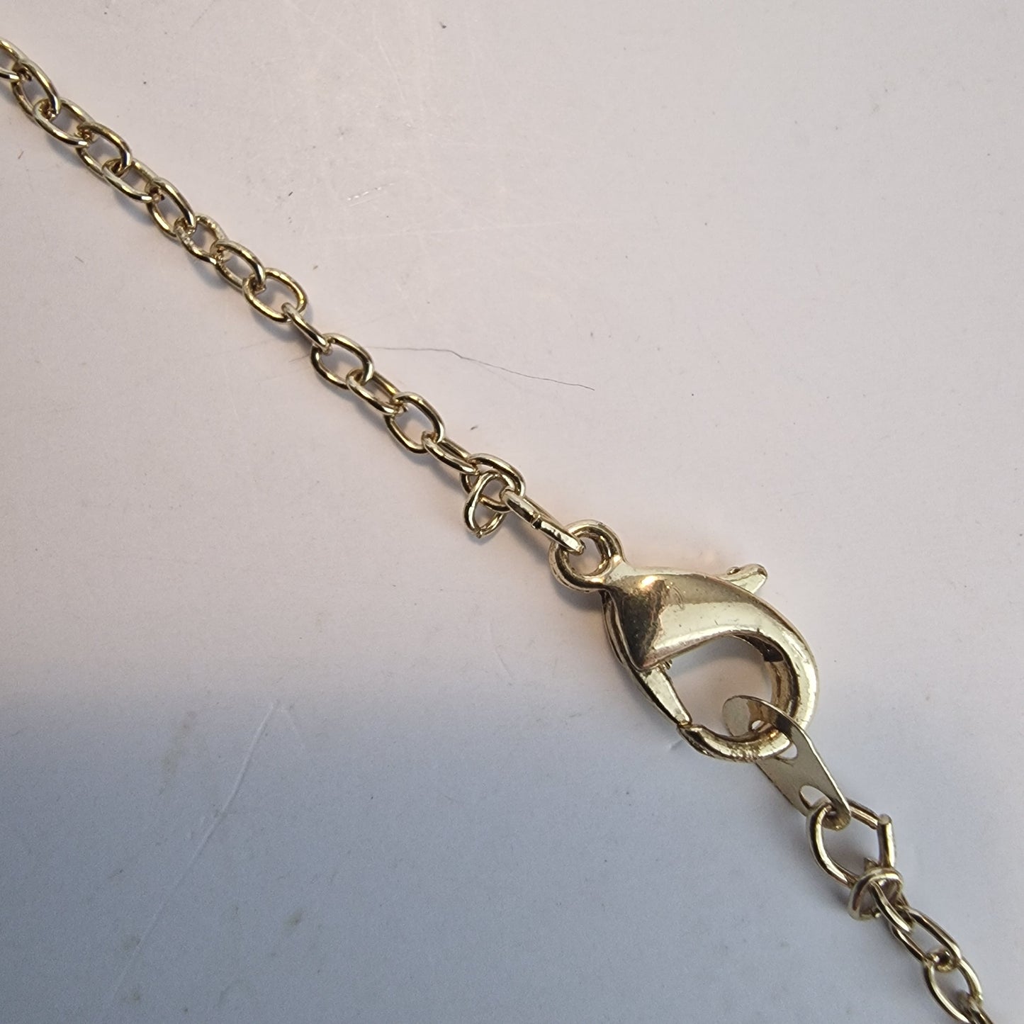 Vintage 1990s Gold-Tone Pendant Necklace Purple Rhinestone Geometric Twist Drop – photo 6