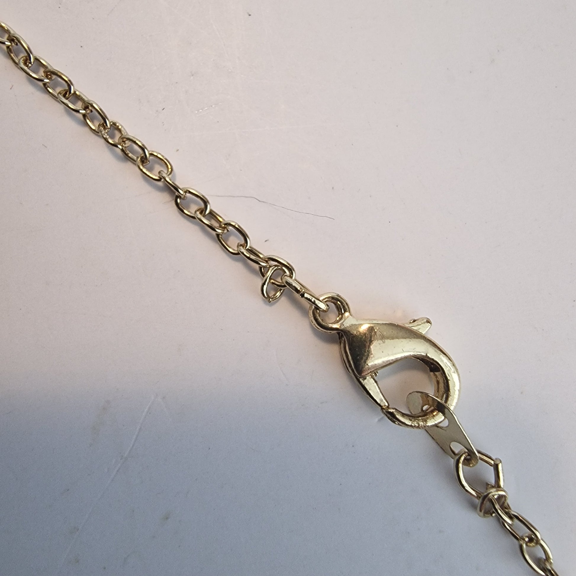 Vintage 1990s Gold-Tone Pendant Necklace Purple Rhinestone Geometric Twist Drop – photo 6