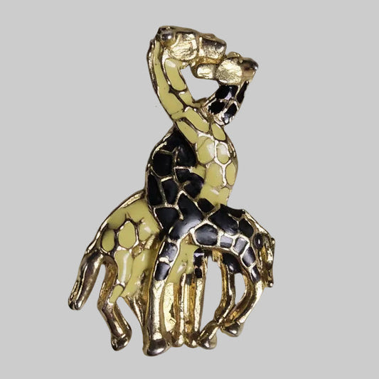 Gold and black detailed figurine on a gray background