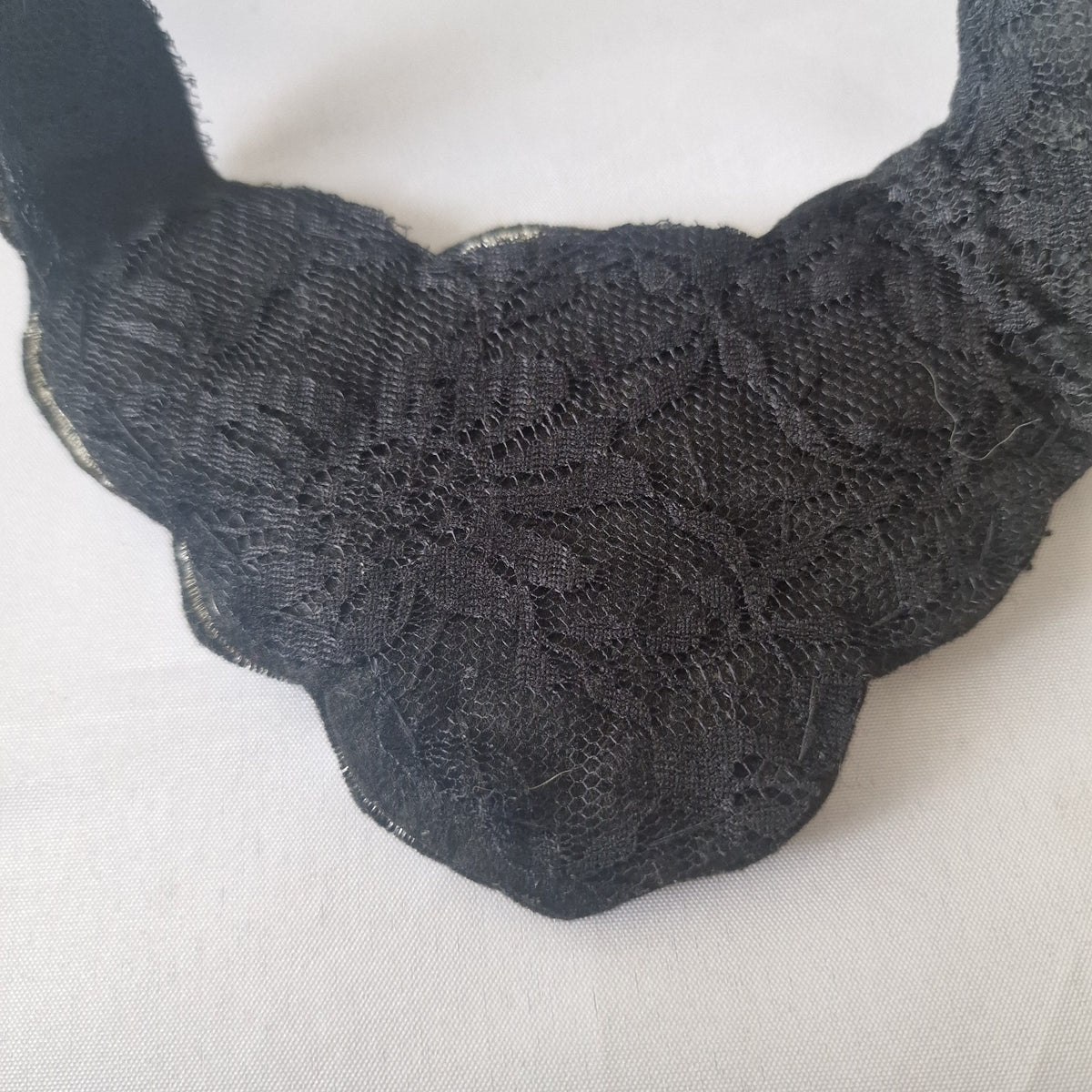 Back view of black lace textile bib necklace