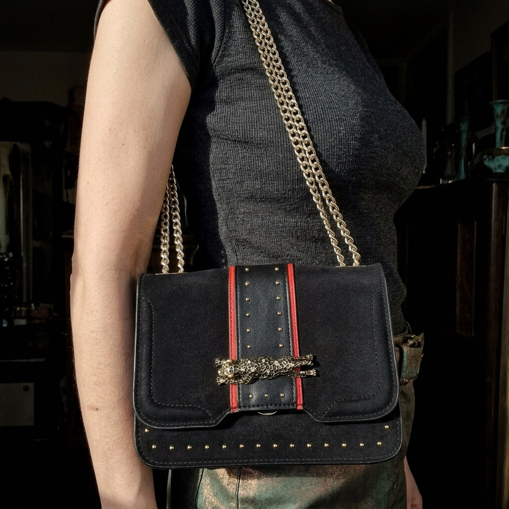 Topshop Modern Black Shoulder Bag Red Trim Gold Tone Chain Strap Leopard Clasp, shown carried by a model