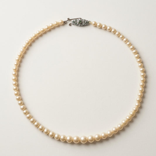 Vintage 1950s Cream Real Pearl Necklace Graduated Silver-Tone Green Stone Clasp, studio front view