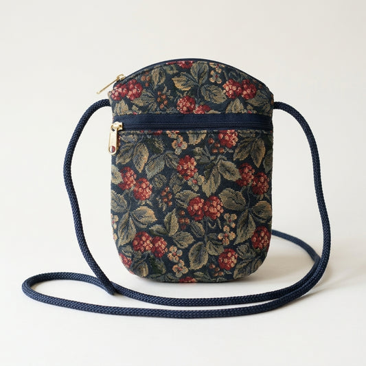 Vintage 1980s Navy Tapestry Crossbody Bag Floral Berry Gold-Tone Zip Cord Strap, studio front view